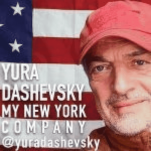 Portrait of Yura Dashevsky wearing a red cap, set against a background featuring an American flag and the text 'Yura Dashevsky My New York Company'."